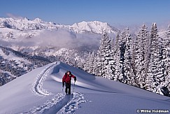 Backcountry Skier hiking up ridgeline in big cottonwood canyon, Utah